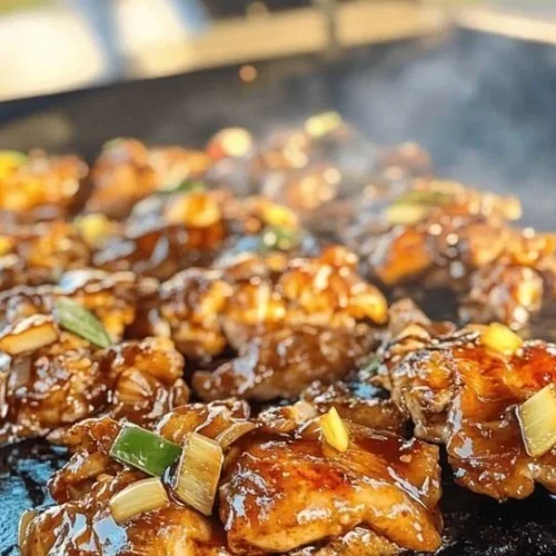 Delicious Blackstone Bourbon Chicken served on a plate