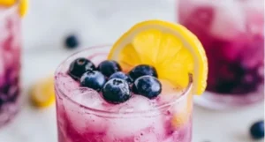 Refreshing Blueberry Lemonade Vodka Smash cocktail in a glass
