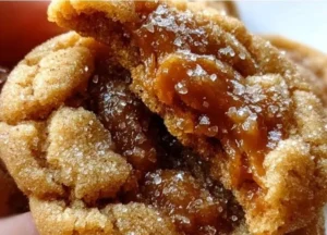 Brown Sugar Caramel Crinkle Cookies freshly baked and sprinkled with powdered sugar