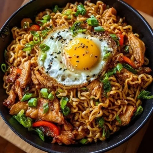 Delicious chicken ramen stir fry with vegetables and sauce in a bowl