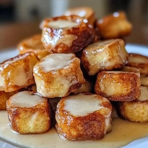 Delicious Cinnamon Roll French Toast Bites served on a plate