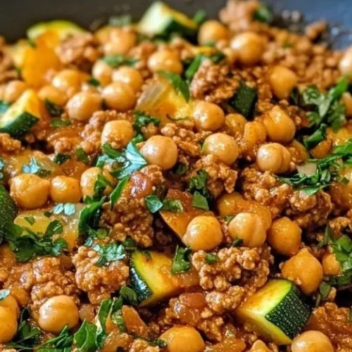 Ground turkey zucchini chickpea skillet in a pan garnished with parsley