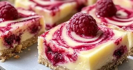 Lemon Raspberry Swirl Bars with a vibrant swirled topping and a golden crust