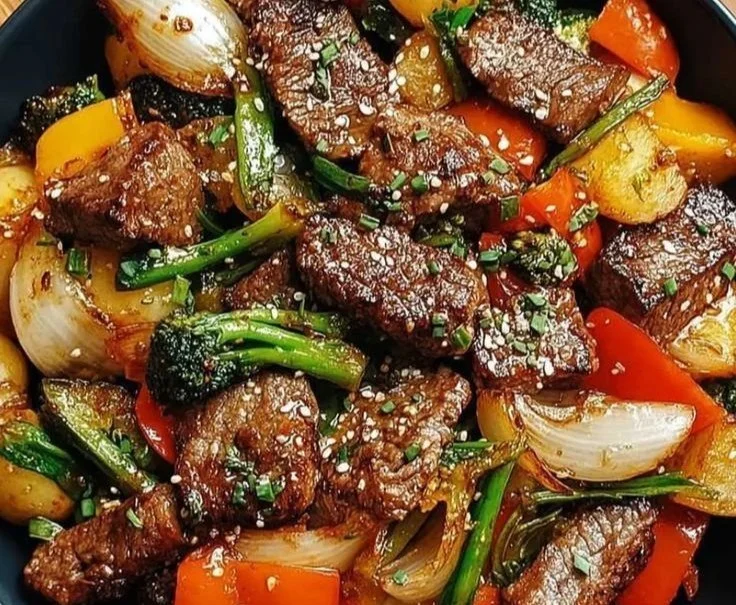 Colorful quick weeknight stir fry with fresh vegetables and protein in a wok