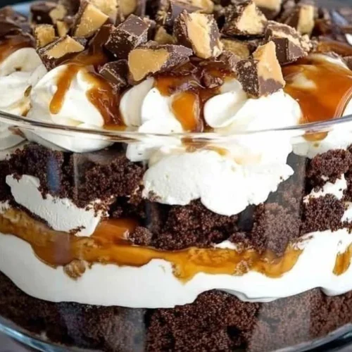 Scoop of Heaven Trifle dessert with layers of cream and fruit