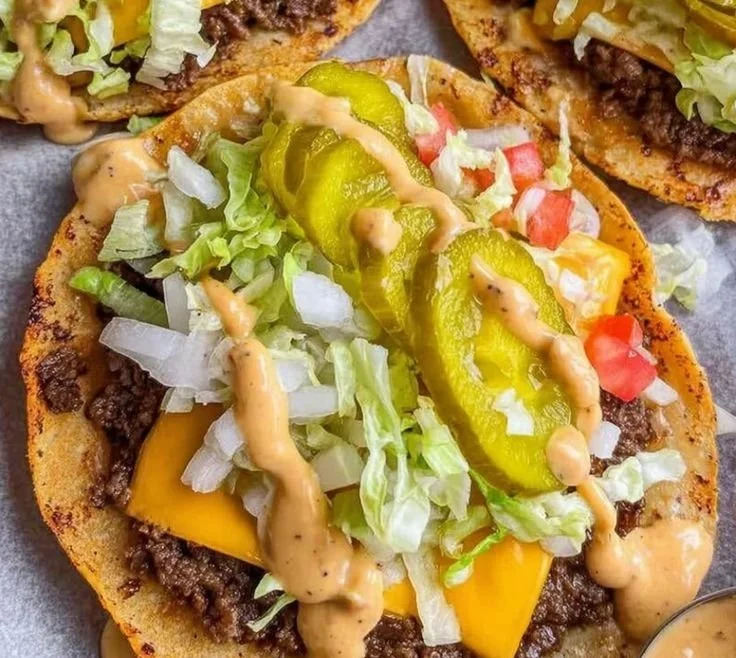 Delicious smash burger tacos served with fresh toppings and sauces