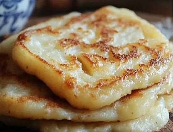 Homemade authentic Irish potato farls on a rustic wooden table.