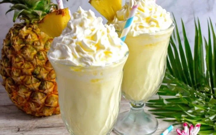 Delicious Boozy Dole Whip dessert with tropical flavors and rum.