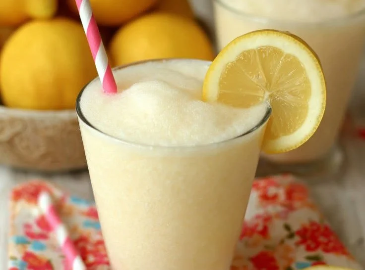 Chick Fil A Frosted Lemonade in a frosty cup with lemon slices