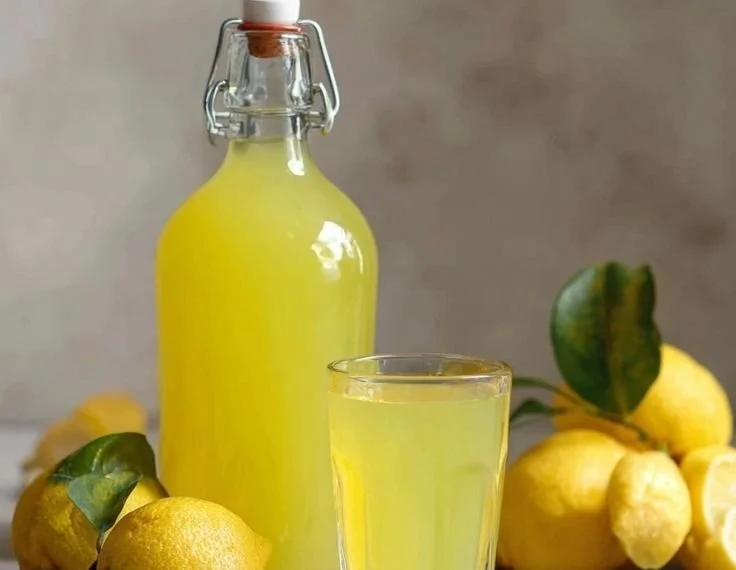 Homemade Italian Limoncello in a glass on a sunny table