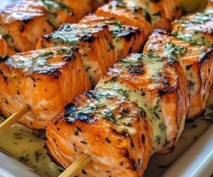 Delicious grilled salmon skewers garnished with herbs and spices.