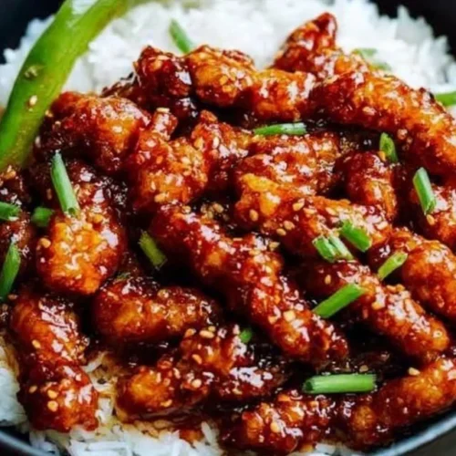 Indo-Chinese Dragon Chicken served with vibrant vegetables and spices.