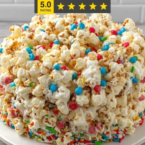 Delicious homemade popcorn cake decorated with colorful toppings