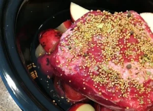 Slow-cooker corned beef brisket in a serving dish with vegetables