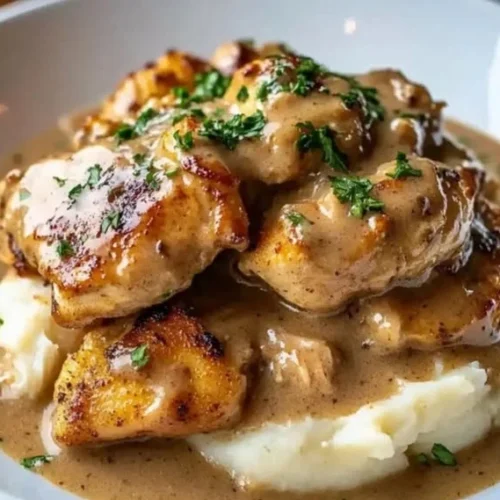 Delicious Crockpot Chicken and Gravy served with mashed potatoes