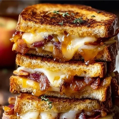 Hot Honey Apple Cheddar Beef Bacon Grilled Cheese sandwich with crispy bacon and melted cheese