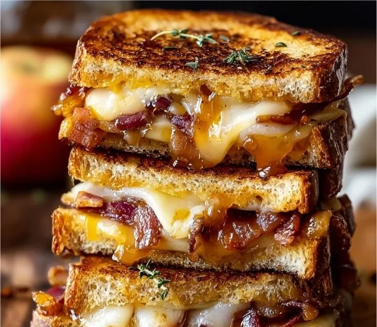 Hot Honey Apple Cheddar Beef Bacon Grilled Cheese sandwich with crispy bacon and melted cheese