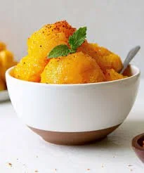 Delicious mango sorbet served in a bowl, a refreshing dairy-free dessert.