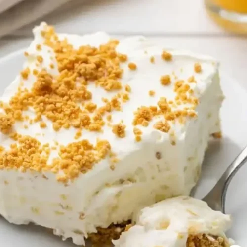 Delicious mom's no bake pineapple dessert served in a glass dish.