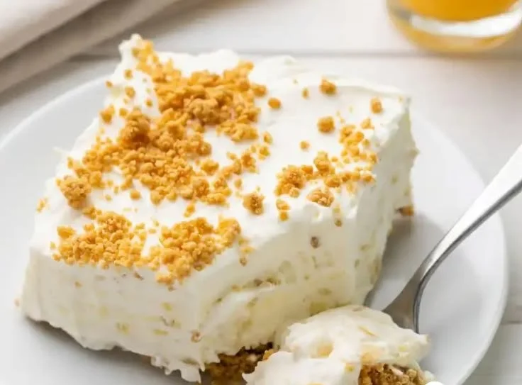 Delicious mom's no bake pineapple dessert served in a glass dish.