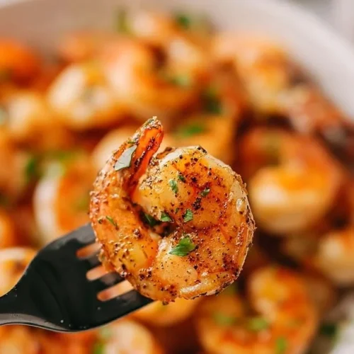 Delicious mouthwatering grilled shrimp cooking on a Blackstone griddle