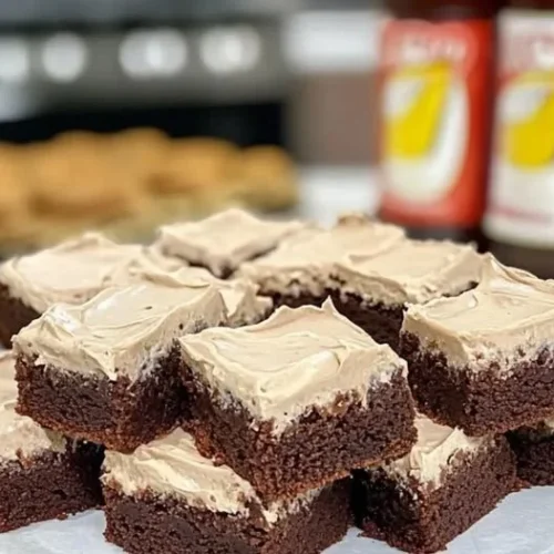 Delicious root beer float brownies topped with whipped cream and cherry