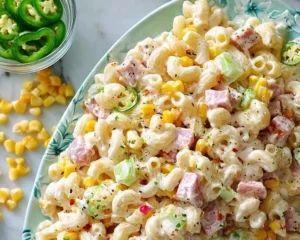 Colorful Mexican ham pasta salad with vegetables and dressing