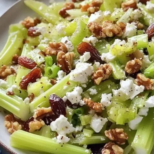 Fresh Walnut Celery Salad with Feta cheese garnished with herbs