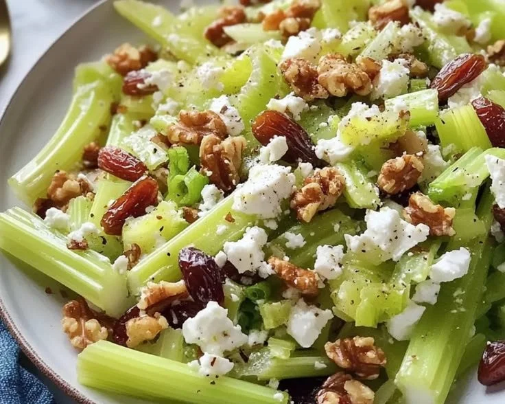 Fresh Walnut Celery Salad with Feta cheese garnished with herbs