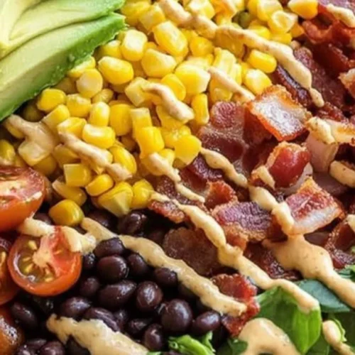 Colorful Cowboy Salad with fresh vegetables, beans, and dressing