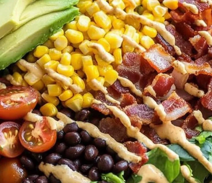 Colorful Cowboy Salad with fresh vegetables, beans, and dressing