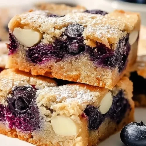 Fudgy blueberry blondies with fresh blueberries and a golden crust.