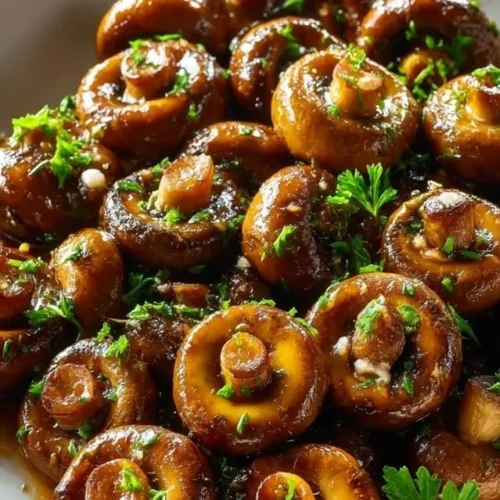 Delicious Garlic Butter Soy Glazed Mushrooms served in a bowl