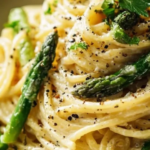 Lemon Ricotta Pasta with Asparagus topped with fresh herbs and lemon zest