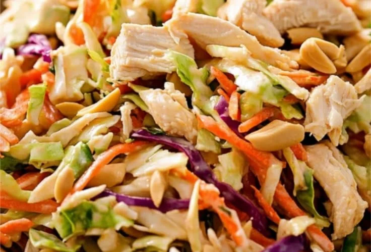 Thai Peanut Chicken Crunch Slaw Salad with colorful vegetables and peanut dressing