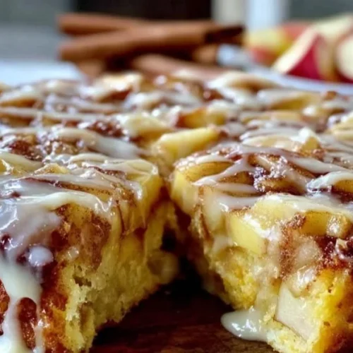 Delicious brown butter apple cinnamon skillet cake served warm in a skillet.