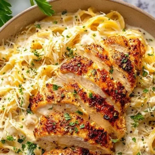 Delicious Chicken Alfredo topped with garlic Parmesan sauce