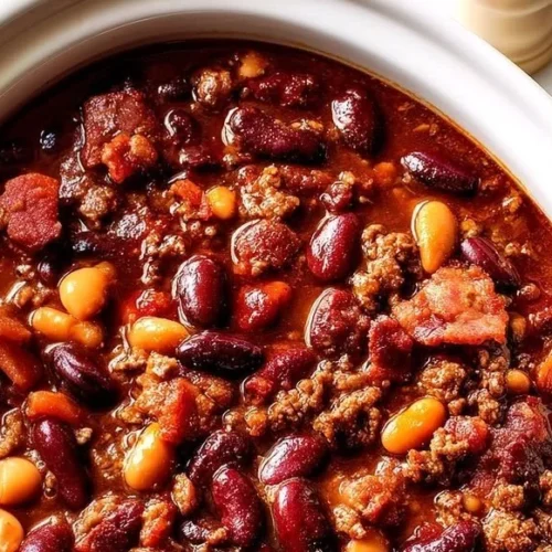 Delicious Cowboy Beans served in a crockpot, perfect for family meals.