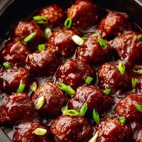 Delicious Crockpot BBQ meatballs served in a bowl with sauce