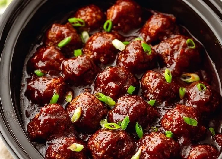 Delicious Crockpot BBQ meatballs served in a bowl with sauce