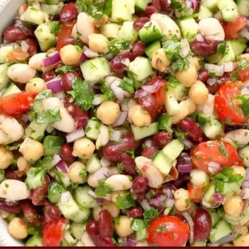 Colorful Mediterranean Bean Salad with tomatoes, olives, and herbs
