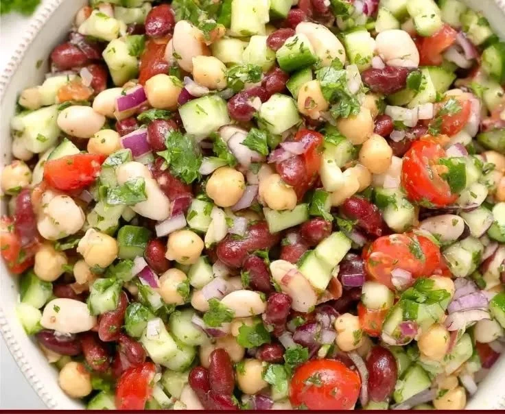 Colorful Mediterranean Bean Salad with fresh vegetables and herbs