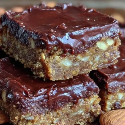 No-bake almond butter chocolate fudge bars on a plate