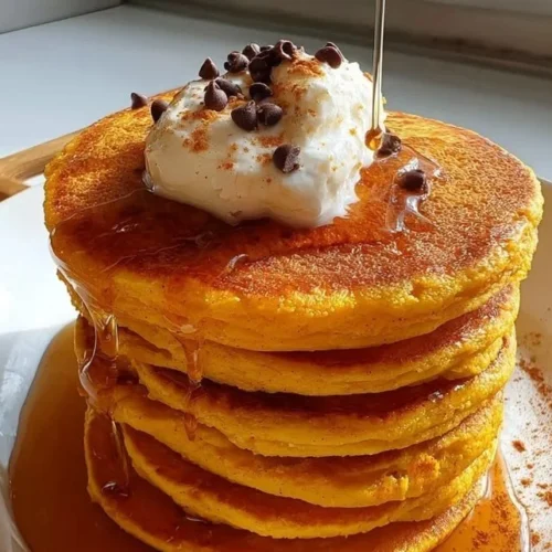 Fluffy pumpkin cottage cheese pancakes served with syrup and spices