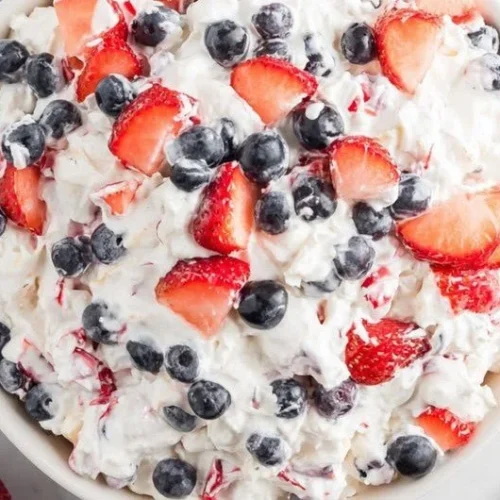 Delicious Red White and Blue Cheesecake Salad served in a bowl