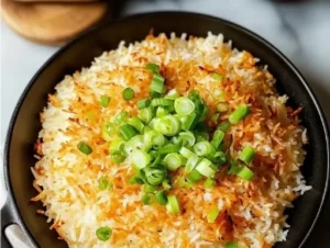 Bobby Flay's delicious crispy rice served on a plate with fresh ingredients.