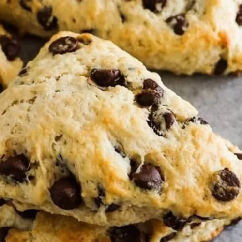 Freshly baked chocolate chip scones on a cooling rack