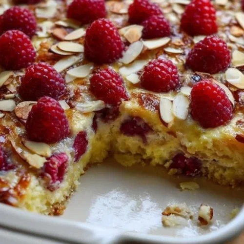 Cottage cheese raspberry almond casserole served in a dish, ready to eat