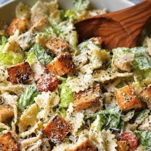 Bowl of easy Chicken Caesar Pasta Salad with fresh ingredients