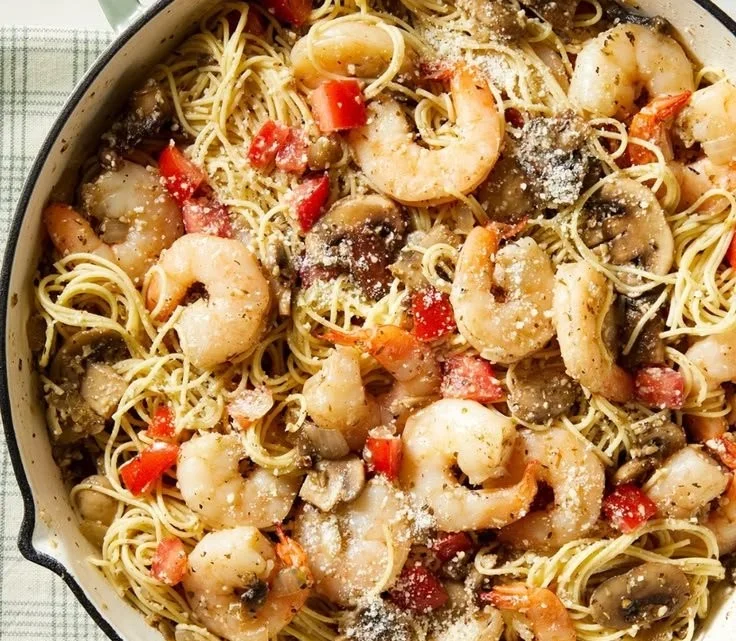 Mushroom Garlic Shrimp Pasta in a bowl garnished with parsley